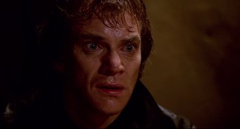 Movie still from “Cat People” (1982), directed by Paul Schrader – A person with wet hair; Close Up shot, Low angle