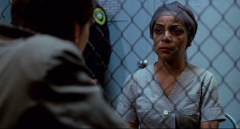 Movie still from “Cat People” (1982), directed by Paul Schrader – A woman looking at herself in the mirror; Close Up shot, Over the shoulder angle