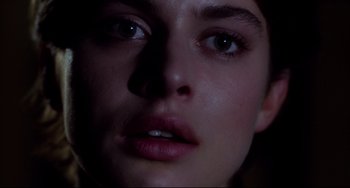 Movie still from “Cat People” (1982), directed by Paul Schrader – A woman's face in the dark; Extreme Close Up shot, Low angle