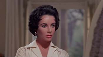 Movie still from “Cat on a Hot Tin Roof” (1958), directed by Richard Brooks – A person wearing a dress shirt; Close Up shot, High angle