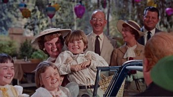 Movie still from “Cat on a Hot Tin Roof” (1958), directed by Richard Brooks – A group of people standing next to each other; Medium shot, Over the shoulder angle