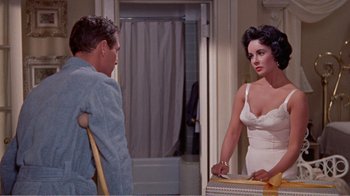 Movie still from “Cat on a Hot Tin Roof” (1958), directed by Richard Brooks – A man and a woman in a bathroom talking to each other; Medium shot, High angle