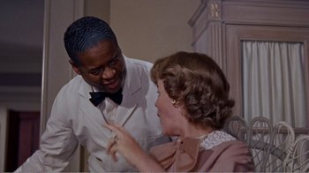 Movie still from “Cat on a Hot Tin Roof” (1958), directed by Richard Brooks – An older man and a younger woman are talking to each other; Medium shot, Over the shoulder angle