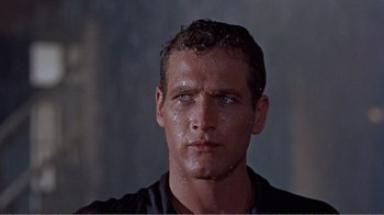 Movie still from “Cat on a Hot Tin Roof” (1958), directed by Richard Brooks – A person wearing a black shirt; Close Up shot, Low angle