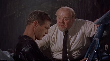 Movie still from “Cat on a Hot Tin Roof” (1958), directed by Richard Brooks – A man and a man in a tie; Medium shot, Over the shoulder angle