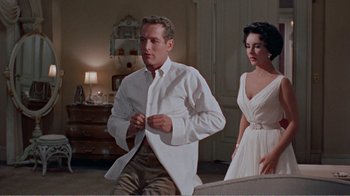 Movie still from “Cat on a Hot Tin Roof” (1958), directed by Richard Brooks – A man and a woman standing in a living room; Medium shot, Low angle