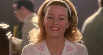 Movie still from “Catch Me If You Can” (2002), directed by Steven Spielberg – A person wearing a headband; Close Up shot, Over the shoulder angle