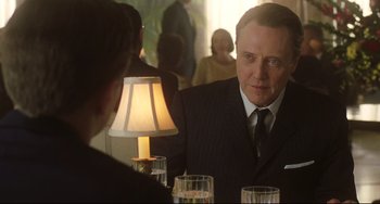 Movie still from “Catch Me If You Can” (2002), directed by Steven Spielberg – A man sitting at a dinner table looking at a woman; Close Up shot, Over the shoulder angle