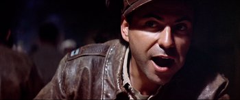 Movie still from “Catch-22” (1970), directed by Mike Nichols – A person wearing a leather jacket; Close Up shot, Low angle