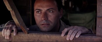 Movie still from “Catch-22” (1970), directed by Mike Nichols – A person looking at the camera; Close Up shot, Low angle