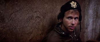 Movie still from “Catch-22” (1970), directed by Mike Nichols – A young man wearing a hat and a jacket; Close Up shot, Low angle