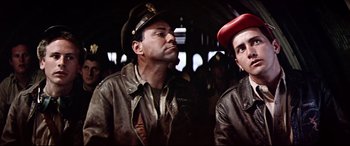 Movie still from “Catch-22” (1970), directed by Mike Nichols – Two men in military uniforms are looking at each other; Close Up shot, Low angle