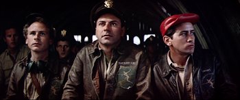 Movie still from “Catch-22” (1970), directed by Mike Nichols – A man in a leather jacket and a hat; Close Up shot, Low angle