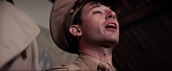 Movie still from “Catch-22” (1970), directed by Mike Nichols – A person wearing a uniform; Close Up shot, Low angle