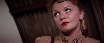 Movie still from “Catch-22” (1970), directed by Mike Nichols – A person wearing a military uniform; Close Up shot, Low angle