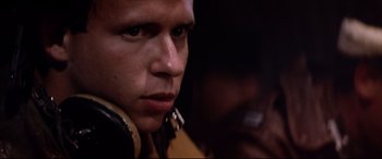 Movie still from “Catch-22” (1970), directed by Mike Nichols – A person wearing a leather jacket; Close Up shot, Low angle