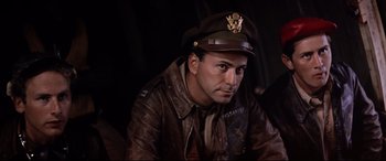 Movie still from “Catch-22” (1970), directed by Mike Nichols – A man in a leather jacket and a hat; Close Up shot, Low angle