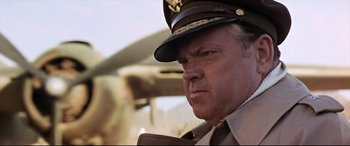 Movie still from “Catch-22” (1970), directed by Mike Nichols – A person wearing a hat; Close Up shot, Low angle