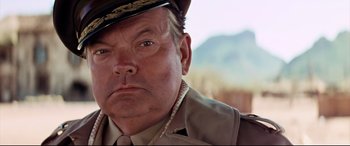 Movie still from “Catch-22” (1970), directed by Mike Nichols – A person wearing a uniform; Close Up shot, Low angle