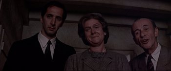 Movie still from “Catch-22” (1970), directed by Mike Nichols – A man and a woman standing next to each other; Close Up shot, Low angle