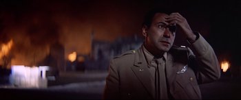 Movie still from “Catch-22” (1970), directed by Mike Nichols – A man in a military uniform looking off into the distance; Close Up shot, Low angle