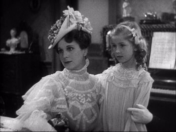 Movie still from “Cavalcade” (1933), directed by Frank Lloyd – A woman and a little girl standing next to each other; Medium shot, High angle