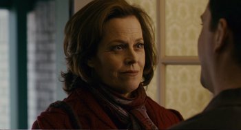 Movie still from “Cedar Rapids” (2011), directed by Miguel Arteta – A person wearing a scarf; Close Up shot, Over the shoulder angle