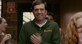 Movie still from “Cedar Rapids” (2011), directed by Miguel Arteta – A man in a green shirt clapping his hands; Close Up shot, Over the shoulder angle