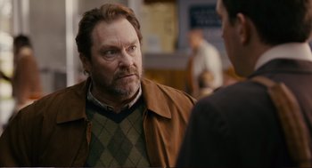 Movie still from “Cedar Rapids” (2011), directed by Miguel Arteta – An older man with a beard is talking to a younger man; Close Up shot, Over the shoulder angle