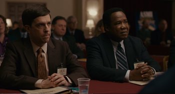 Movie still from “Cedar Rapids” (2011), directed by Miguel Arteta – Two men sitting at a table in front of each other; Medium shot, Over the shoulder angle