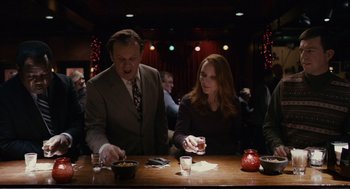 Movie still from “Cedar Rapids” (2011), directed by Miguel Arteta – A man and a woman sitting at a table; Medium shot, Over the shoulder angle