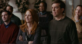 Movie still from “Cedar Rapids” (2011), directed by Miguel Arteta – A man and a woman standing next to each other; Medium shot, Over the shoulder angle