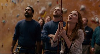Movie still from “Cedar Rapids” (2011), directed by Miguel Arteta – A group of people standing around looking up at the sky; Medium shot, Low angle