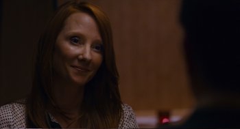 Movie still from “Cedar Rapids” (2011), directed by Miguel Arteta – A person with long red hair; Close Up shot, Over the shoulder angle