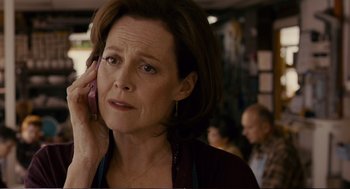 Movie still from “Cedar Rapids” (2011), directed by Miguel Arteta – A person talking on a cell phone; Close Up shot, Over the shoulder angle