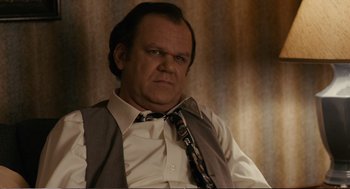 Movie still from “Cedar Rapids” (2011), directed by Miguel Arteta – A person wearing a suit and tie; Close Up shot, Low angle