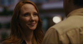Movie still from “Cedar Rapids” (2011), directed by Miguel Arteta – A person with long red hair; Close Up shot, Over the shoulder angle