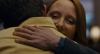 Movie still from “Cedar Rapids” (2011), directed by Miguel Arteta – A man and a woman hugging each other; Close Up shot, Over the shoulder angle