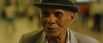 Movie still from “Central Station” (1998), directed by Walter Salles – An older man wearing a hat and a suit; Close Up shot, Low angle