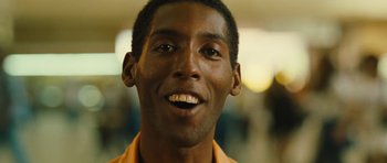 Movie still from “Central Station” (1998), directed by Walter Salles – A person smiling; Close Up shot, Low angle