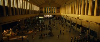 Movie still from “Central Station” (1998), directed by Walter Salles – A crowd of people walking around a large building; Extreme Wide shot, High angle
