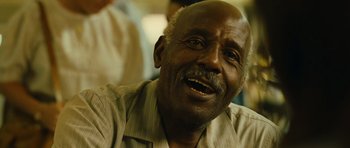 Movie still from “Central Station” (1998), directed by Walter Salles – An older man is smiling and looking up at the sky; Close Up shot, Low angle