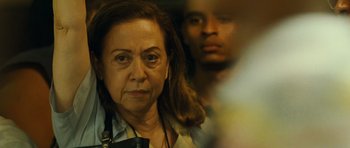 Movie still from “Central Station” (1998), directed by Walter Salles – An older woman and a young man are reflected in a mirror; Close Up shot, Over the shoulder angle