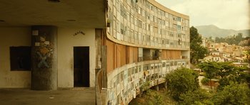 Movie still from “Central Station” (1998), directed by Walter Salles – A building that has many windows on the side of it; Extreme Wide shot, Low angle