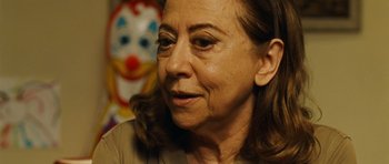 Movie still from “Central Station” (1998), directed by Walter Salles – An older woman is looking into the distance; Close Up shot, Over the shoulder angle