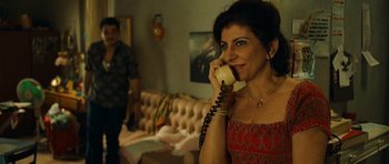 Movie still from “Central Station” (1998), directed by Walter Salles – A woman talking on a phone while standing in a room; Close Up shot, Over the shoulder angle