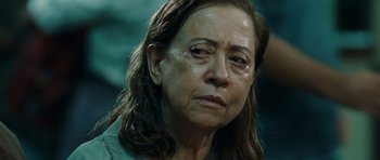 Movie still from “Central Station” (1998), directed by Walter Salles – An older woman with tears in her eyes; Close Up shot, Over the shoulder angle