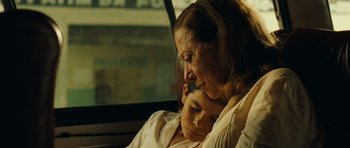 Movie still from “Central Station” (1998), directed by Walter Salles – An older woman and a young boy sitting in a car; Close Up shot, Over the shoulder angle
