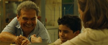 Movie still from “Central Station” (1998), directed by Walter Salles – A man and a boy sitting at a dining table; Close Up shot, Over the shoulder angle