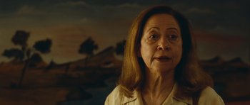 Movie still from “Central Station” (1998), directed by Walter Salles – An older woman is looking at the camera; Close Up shot, Over the shoulder angle